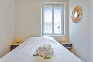 Ένα ή περισσότερα κρεβάτια σε δωμάτιο στο Appartement Claro - Welkeys