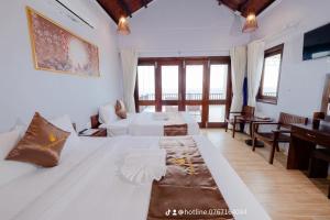 Postel nebo postele na pokoji v ubytování The Poplar Resort Phú Quốc