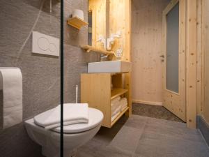 a bathroom with a toilet and a sink at Apartment Glamping Lodge A by Interhome in Ossiach
