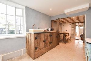 a kitchen with a sink and a counter at Hastings Old town Cottage style in Hastings