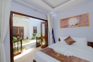 Postel nebo postele na pokoji v ubytování The Poplar Resort Phú Quốc