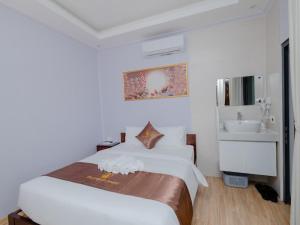 Postel nebo postele na pokoji v ubytování The Poplar Resort Phú Quốc