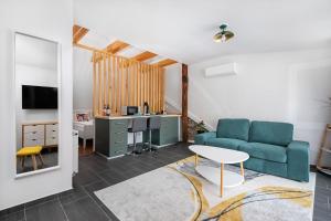 a living room with a couch and a table at Papoula Vendégház in Tihany