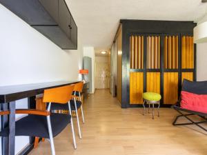 a room with chairs and a bar in a room at Studio Alboran by Interhome in Salou
