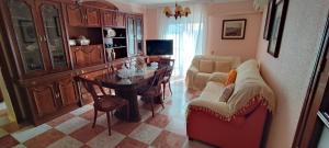 a living room with a table and a couch at El Molino in Lentegí