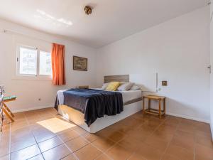 a bedroom with a bed and a tiled floor at Apartment Sicilia-2 by Interhome in Salou