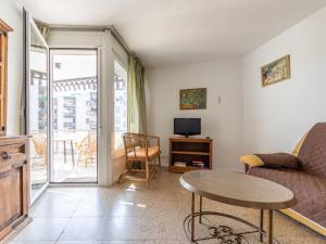 a living room with a couch and a table at Apartment Sicilia-2 by Interhome in Salou