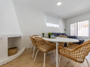 a living room with a white table and chairs at Holiday Home Noelia by Interhome in Torredembarra