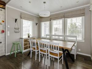 a dining room with a table and chairs at Holiday Home Kotikumpu by Interhome 