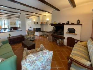 a living room with a couch and a fireplace at Holiday Home Ca' Breia by Interhome in Castel Rocchero