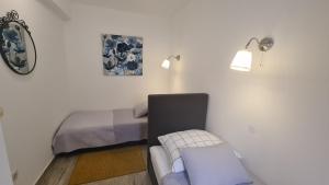 Postel nebo postele na pokoji v ubytování Apartman Muracca