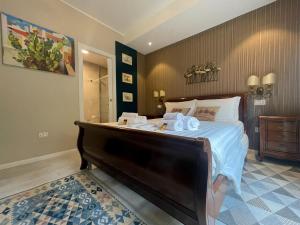 Postel nebo postele na pokoji v ubytování Hermitage Suites