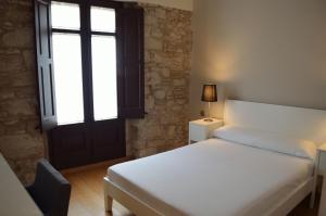 Posteľ alebo postele v izbe v ubytovaní Girona Housing Ginesta 9