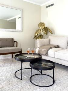 a living room with a coffee table and a couch at Cosy stay - LA CROISETTE in Cannes