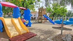 a playground with a slide at Hotel Residence Torre Del Porto in Mattinata