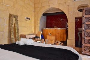 Postel nebo postele na pokoji v ubytování Chapel 5 Boutique Suites B&B