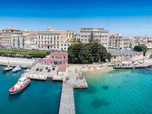 a view of a harbor with boats in the water at Villa Danilo - Sicilia Vacanza in Avola