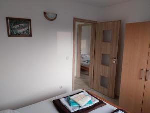 Ein Bett oder Betten in einem Zimmer der Unterkunft Apartman Tamara