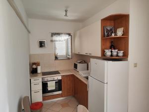 Η κουζίνα ή μικρή κουζίνα στο Apartman Toni
