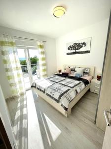 Postel nebo postele na pokoji v ubytování Holiday house "Sabine green" + 27 fotografií