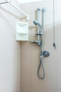 a shower with a shower head in a bathroom at SE008 - Senigallia, bilocale sul mare con spiaggia in Senigallia