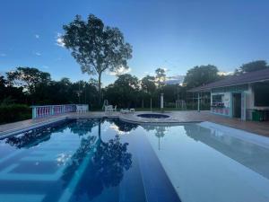 a swimming pool in front of a house at La Posada Circa in Montenegro