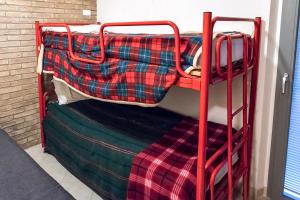 a couple of bunk beds in a room at SE010 - Senigallia, bilocale sul mare con spiaggia in Senigallia