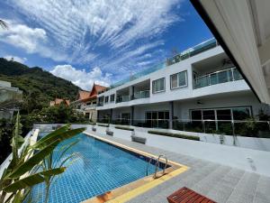 an image of a building with a swimming pool at Kata Top View by Lofty in Kata Beach