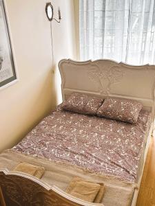 מיטה או מיטות בחדר ב-Apartament nad Jeziorem Juno Mrągowo