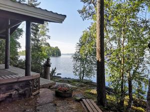 a porch of a house with a view of a lake at Kallioranta in Lestijärvi
