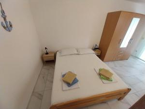 Ein Bett oder Betten in einem Zimmer der Unterkunft Apartman Tamara