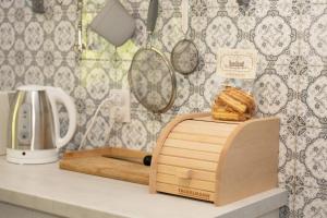 a kitchen counter with a cutting board and a toaster at Casa Madera in Karlovac