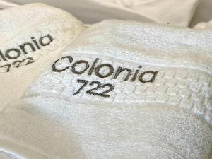 a pile of towels with the word colombia on them at 201 Aparta Studio Boutique en mansión siglo XIX in Bogotá