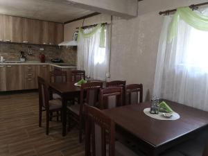 a kitchen and dining room with a table and chairs at Angel&MAR in Velingrad