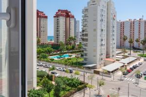a view of a city with tall buildings at Apartamento Costa de Marfil Touriplaya a 200 metros del mar SOLO FAMILIAS in Playa de Gandia