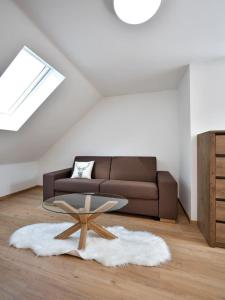 a living room with a couch and a coffee table at Penzion SALAŠ in Salaš