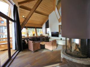 a living room with a couch and a fireplace at Chalet Avoriaz, 6 pièces, 12 personnes - FR-1-314-192 in Avoriaz