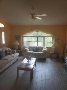 a living room with two couches and a coffee table at Perfect Getaway in Palm Coast