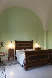 a bedroom with a bed and two night stands at Villa Urso bed&breakfast in Monteroni di Lecce