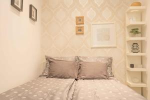 Postel nebo postele na pokoji v ubytování Paulay Design Apartment