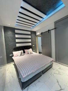 Appartement moderne avec Hammam en plein centre ville 객실 침대