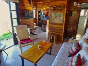 a living room with a couch and a coffee table at La Serena casa de campo y senderismo in Villa Serrana