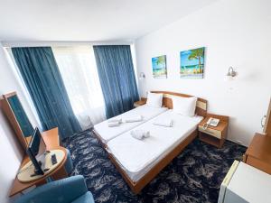 Postel nebo postele na pokoji v ubytování Hotel Sirena Saturn All Inclusive