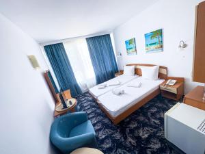 Postel nebo postele na pokoji v ubytování Hotel Sirena Saturn All Inclusive