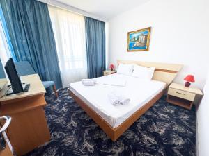 Postel nebo postele na pokoji v ubytování Hotel Sirena Saturn All Inclusive
