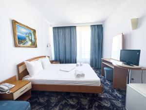 Postel nebo postele na pokoji v ubytování Hotel Sirena Saturn All Inclusive