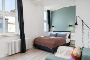 Postel nebo postele na pokoji v ubytování BRIGHT Hildesheim Angoulemeplatz