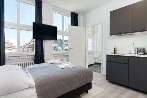 Postel nebo postele na pokoji v ubytování BRIGHT Hildesheim Angoulemeplatz + 22 fotografií