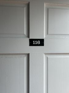 a close up of a door with the number on it at The Admiral Hotel/Motel in Ocean City