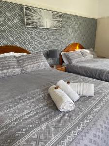 מיטה או מיטות בחדר ב-Nettleton Country House